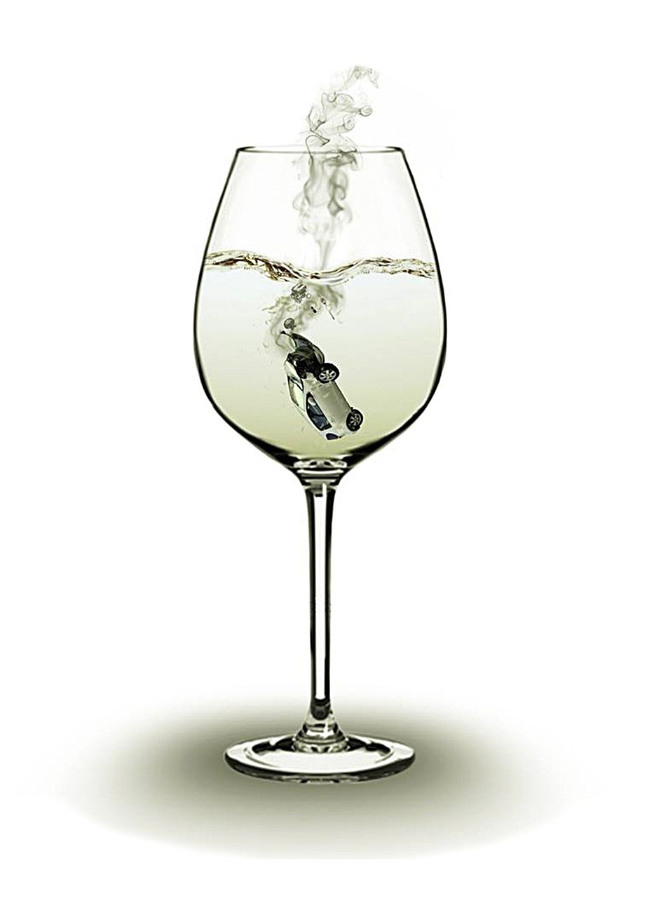 A wine glass with a car in it