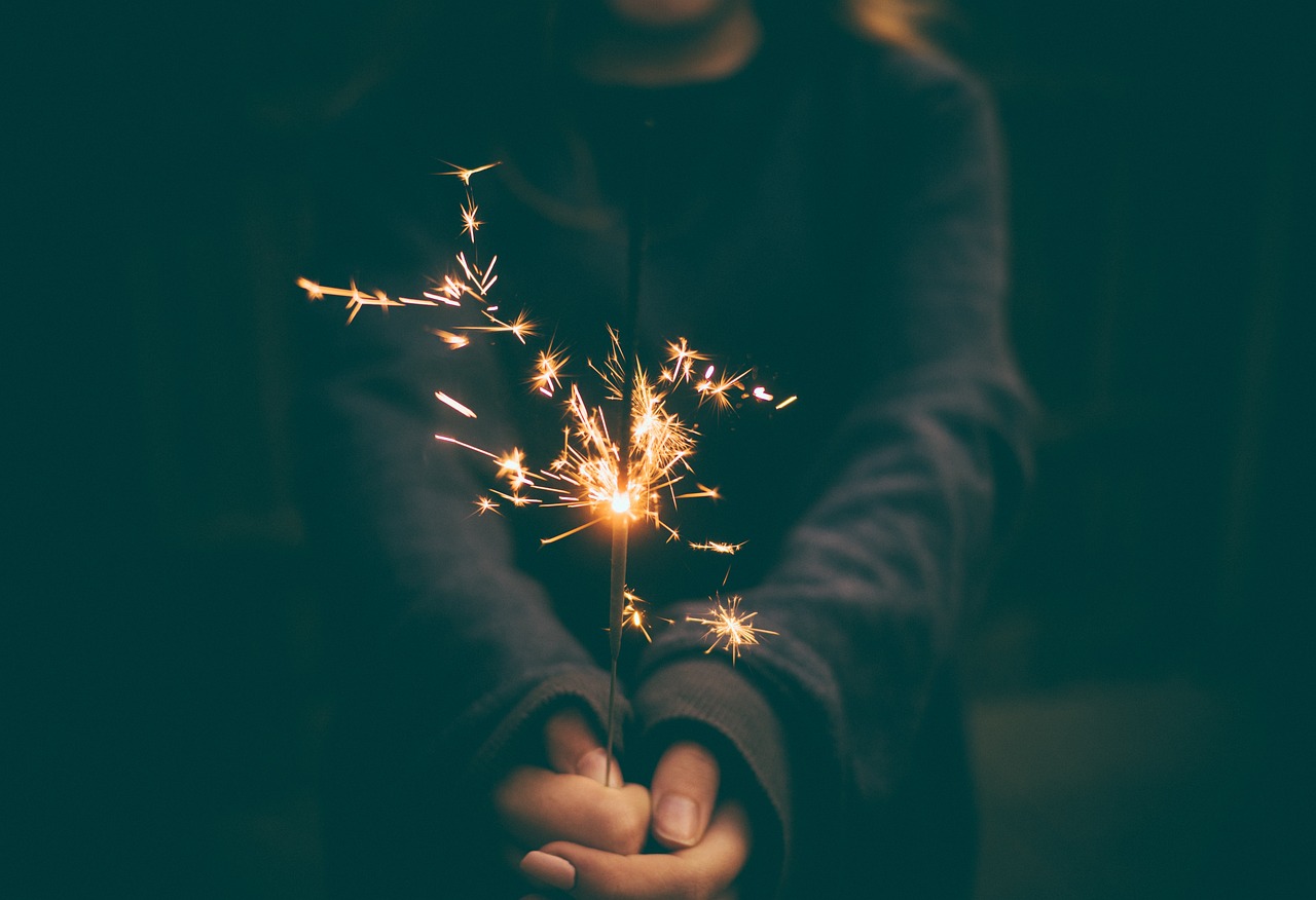 A person holding a sparkler