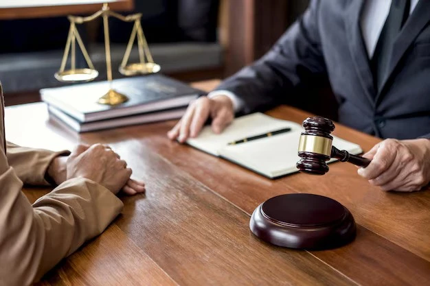 A lawyer having a meeting with a client who is facing Professional Licensing Disciplinary issues.