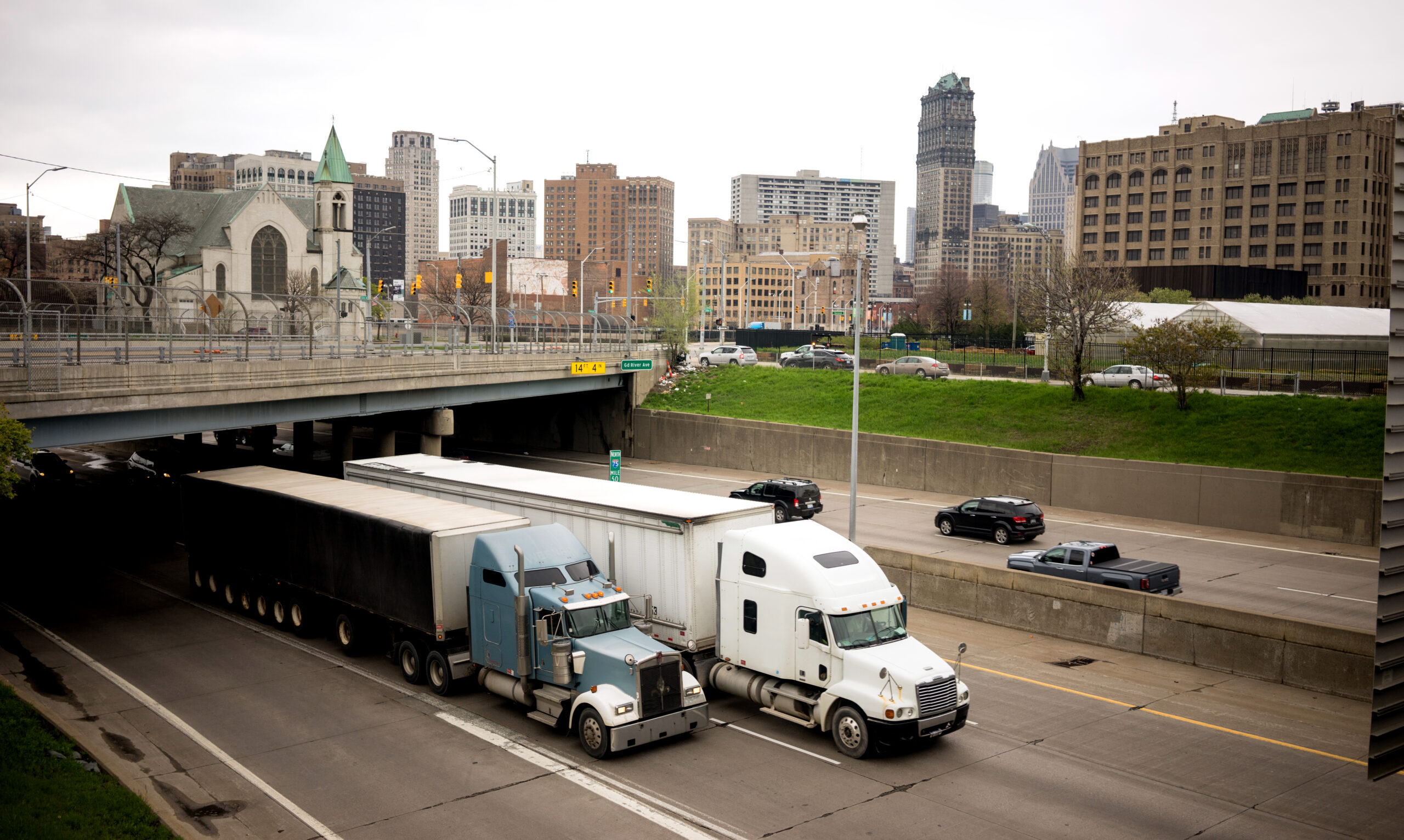 Big Rigs frequent the highways in and around the city in a horizontal composition