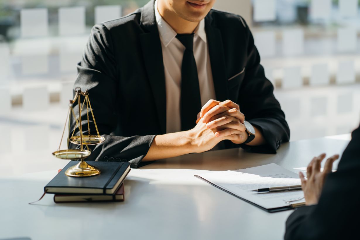 Personal injury attorney meeting with client in St. Louis law office