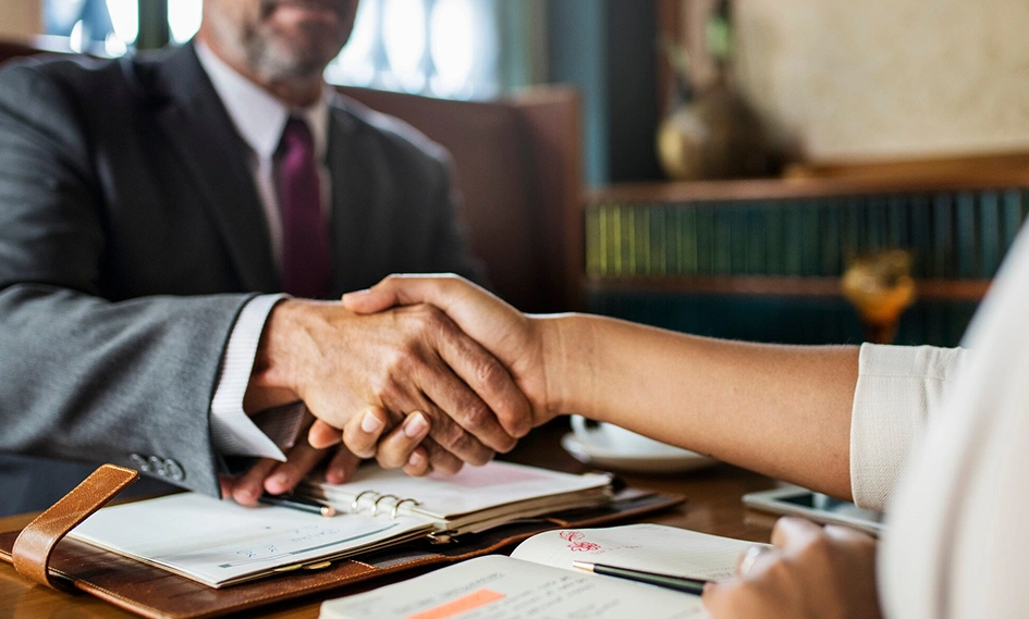 A St. Louis attorney meeting with an accountant for a consultation on professional license disciplinary meeting.