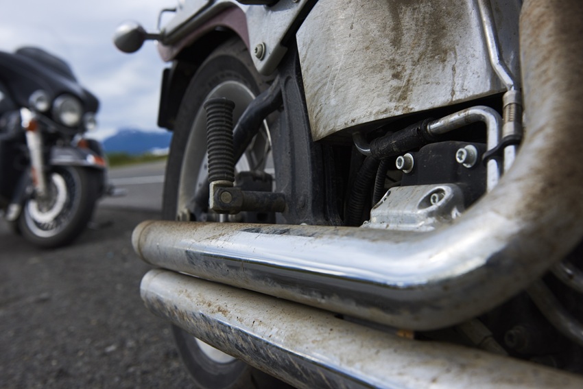 Dirty exhaust pipes on a motorcycle in St. Louis.